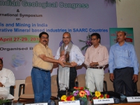 Prof. Pramod K. Verma felicitating Shri P.S. Parihar.