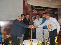 VIPs lighting the sacred lamp for divine guidance.